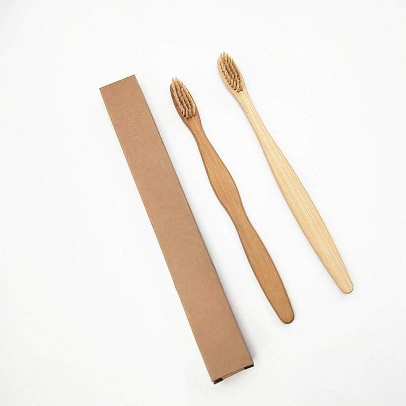 Bamboo toothbrush with infused soft bamboo charcoal bristles and bamboo containers. BPA Free